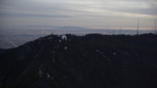 AX0008_049 - 5K aerial stock footage approach Mount Wilson Observatory at twilight in California