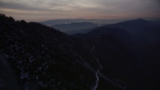 5K aerial stock footage of approaching peaks in the San Gabriel Mountains at twilight, California Aerial Stock Footage | AX0008_059E