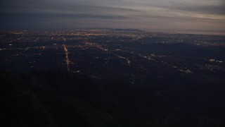 5K aerial stock footage of lights of suburban San Gabriel Valley at twilight in California Aerial Stock Footage | AX0008_062