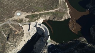 AX0009_015E - 5K aerial stock footage approach Big Tujunga Dam and Reservoir in the mountains, California