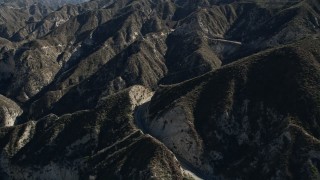 5K aerial  video pan across a lonely road in the San Gabriel Mountains, California Aerial Stock Footage | AX0009_018