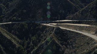 5K aerial stock footage of three motorcycles on a mountain road in the San Gabriel Mountains, California Aerial Stock Footage | AX0009_020