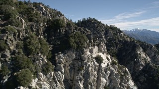 5K aerial stock footage approach and fly over jagged and rocky slopes in the San Gabriel Mountains, California Aerial Stock Footage | AX0009_033E