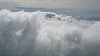 5K aerial stock footage fly over thick cloud cover over San Bernardino County, California Aerial Stock Footage | AX0009_091E