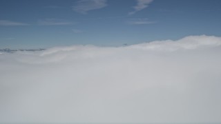 5K aerial stock footage fly over thick blanket of clouds over San Bernardino County, California Aerial Stock Footage | AX0009_102E