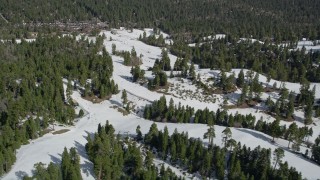 AX0009_130 - 5K aerial stock footage orbit frozen slopes at Snow Summit Ski Resort in winter, California