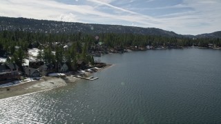 5K aerial stock footage of lakeshore homes with light winter snow at Big Bear Lake, California Aerial Stock Footage | AX0010_020