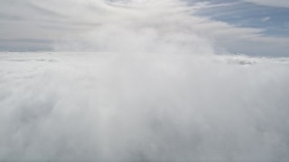 5K aerial stock footage of flying above thick cloud cover in Southern California Aerial Stock Footage | AX0010_074