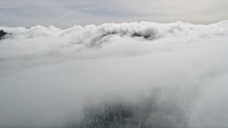 5K aerial stock footage of flying over Southern California clouds Aerial Stock Footage | AX0010_089