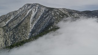 5K aerial stock footage approach a peak with light snow in the San Jacinto Mountains, California Aerial Stock Footage | AX0010_095