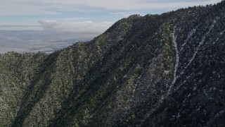 5K aerial stock footage fly over rugged slopes with patches of snow in the San Jacinto Mountains, California Aerial Stock Footage | AX0010_102