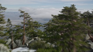 5K aerial stock footage fly over rocky slopes with small patches of snow in the San Jacinto Mountains, California Aerial Stock Footage | AX0010_104E