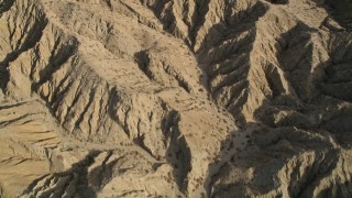 AX0011_003 - 5K aerial stock footage bird's eye view of an arid mountain range in the Mojave Desert, California