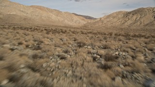 5K aerial stock footage of low altitude approach to desert mountains in Joshua Tree National Park, California Aerial Stock Footage | AX0011_015