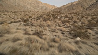 5K aerial stock footage tilt to reveal desert mountains in Joshua Tree National Park, California Aerial Stock Footage | AX0011_017