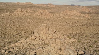 AX0011_030 - 5K aerial stock footage of descending toward rock formations, Joshua Tree National Park, California