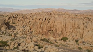 5K aerial stock footage fly over rock formations, Joshua Tree National Park, California Aerial Stock Footage | AX0011_039E