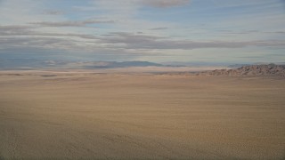 AX0011_067 - 5K aerial stock footage of a view across the Mojave Desert in California