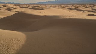 AX0012_008 - 5K aerial stock footage of flying over sand dunes, Kelso Dunes, Mojave Desert, California