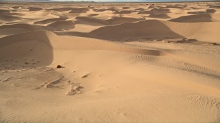 AX0012_014 - 5K aerial stock footage fly by sand dunes, Kelso Dunes, Mojave Desert, California