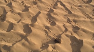 AX0012_019E - 5K aerial stock footage fly over sand dunes, Kelso Dunes, Mojave Desert, California