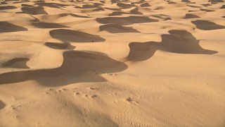 AX0012_023E - 5K aerial stock footage fly over sand dunes, Kelso Dunes, Mojave Desert, California