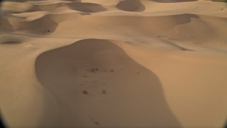 AX0012_026 - 5K aerial stock footage fly low over sand dunes, Kelso Dunes, Mojave Desert, California