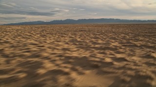 AX0012_038 - 5K aerial stock footage fly by open desert, Mojave Desert, California