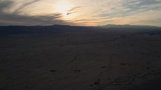 5K aerial stock footage of a desert plain, Mojave Desert, California, sunset Aerial Stock Footage | AX0012_051