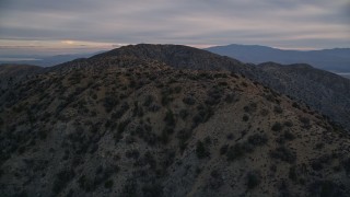 5K aerial stock footage orbiting desert summit peaks, Mojave Desert, California Aerial Stock Footage | AX0012_061