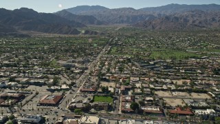 5K aerial stock footage fly over residential neighborhoods toward mountains, Palm Desert, California Aerial Stock Footage | AX0013_073E