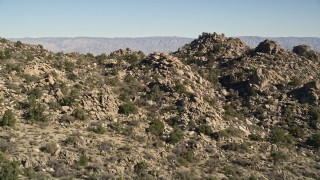 5K aerial stock footage fly over stony mountains revealing Caochella Valley, San Jacinto Mountains, California Aerial Stock Footage | AX0014_009