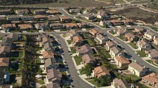 AX0014_036 - 5K aerial stock footage approach residential neighborhood and tract homes, Temecula, California