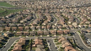 AX0014_039E - 5K aerial stock footage fly low over tract homes in residential neighborhoods, Temecula, California