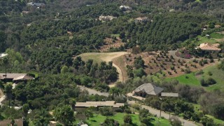 5K aerial stock footage of rural homes among trees, Fallbrook, California Aerial Stock Footage | AX0015_020