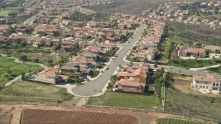 5K aerial stock footage of residential neighborhood near farmland, Oceanside, California Aerial Stock Footage | AX0015_040