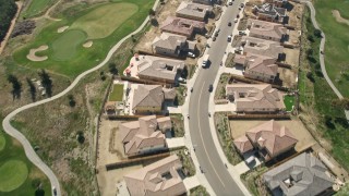 5K aerial stock footage of residential neighborhood and new construction near golf course, Oceanside, California Aerial Stock Footage | AX0015_042