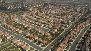 AX0015_058 - 5K aerial stock footage fly over and past tract homes in a residential neighborhood, Oceanside, California