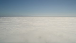 5K aerial stock footage pan across the cloud layer beneath blue skies, California Aerial Stock Footage | AX0016_009