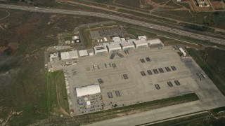 5K aerial stock footage of bird's eye view of military buildings and craft at Camp Pendleton South, California Aerial Stock Footage | AX0016_025