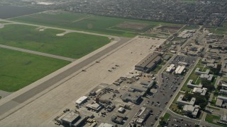 5K aerial stock footage of military helicopters parked at Los Alamitos Army Airfield, California Aerial Stock Footage | AX0016_098