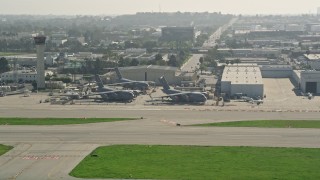 AX0016_113 - 5K aerial stock footage flyby three C-17 Globemasters at Long Beach Airport, California