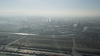 5K aerial stock footage approach oil refinery with smoke stacks, Carson, California Aerial Stock Footage | AX0017_001