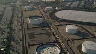 AX0017_006 - 5K aerial stock footage tilt down on an oil refinery, Carson, California