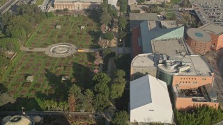 AX0017_047 - 5K aerial stock footage of approaching Exposition Park Rose Garden, University of Southern California