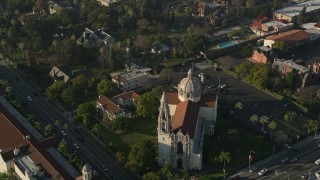 AX0017_055E - 5K aerial stock footage of orbiting St. Vincent Catholic Church, Los Angeles, California