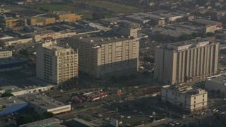 AX0017_061 - 5K aerial stock footage of tracking a helicopter traveling over city buildings, Downtown Los Angeles