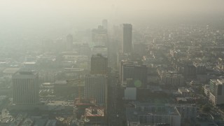 AX0017_076 - 5K aerial stock footage of flying by office buildings in Koreatown, Los Angeles, California