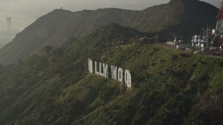 5K aerial stock footage of orbiting the Hollywood Sign in haze, Hollywood, California Aerial Stock Footage | AX0017_093