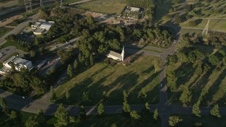 5K aerial stock footage fly over Forest Lawn Memorial Park toward a small church, Hollywood, California Aerial Stock Footage | AX0017_098